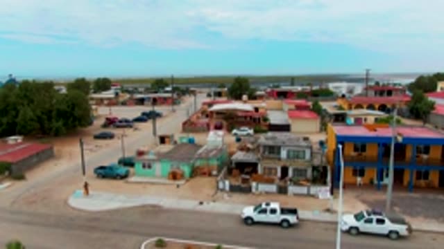 PUENTA ABREOJOS BCS MEXICO-2022: Person Walking in Small Town Street with Descending Camera View