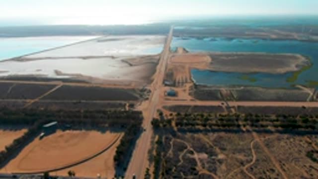 GUERRERO NEGRO BCS MEXICO-2022: Rural Road Through Agricultural Fields and Water Reservoirs