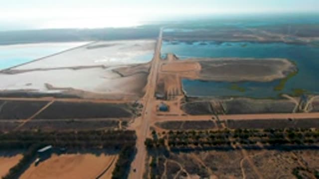 GUERRERO NEGRO BCS MEXICO-2022: Truck Moving on Rural Dirt Road Through Farmland