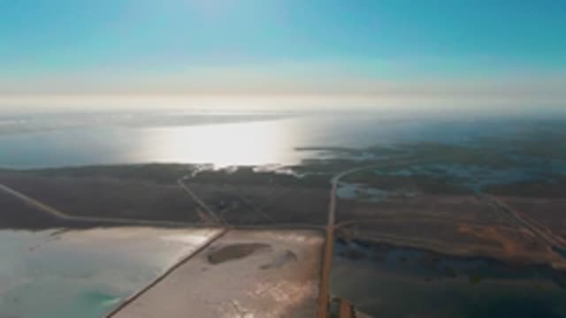 GUERRERO NEGRO BCS MEXICO-2022: Coastal Salt Flats and Ocean Reflections