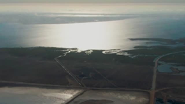 GUERRERO NEGRO BCS MEXICO-2022: Coastal Wetlands and Road with Passing Vehicle