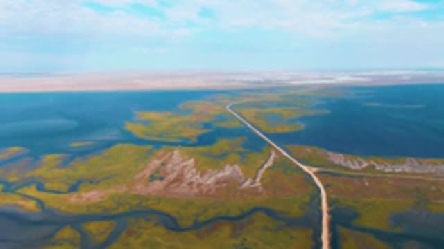 GUERRERO NEGRO BCS MEXICO-2022: Road Winding Through Wetland and Tundra