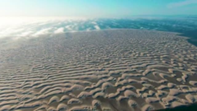 GUERRERO NEGRO BCS MEXICO-2022: Wavy Sand Dunes Under Partly Cloudy Sky