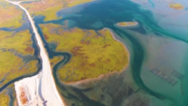 GUERRERO NEGRO BCS MEXICO-2022: Road Winding Through Coastal Wetlands and Waterways