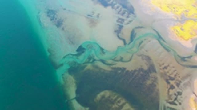 GUERRERO NEGRO BCS MEXICO-2022: Winding Coastal Stream Flowing Into Ocean