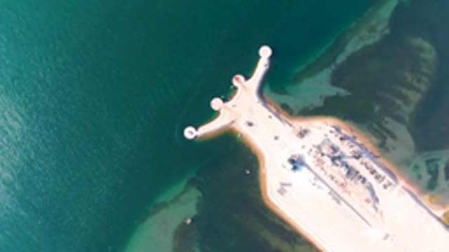 GUERRERO NEGRO BCS MEXICO-2022: Pier Extending Into Calm Ocean Waters