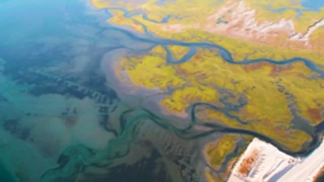 GUERRERO NEGRO BCS MEXICO-2022: Winding River Flowing Across Tundra Terrain