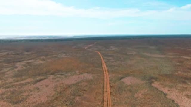 GUERRERO NEGRO BCS MEXICO-2022: Winding Dirt Road Across Arid Plains
