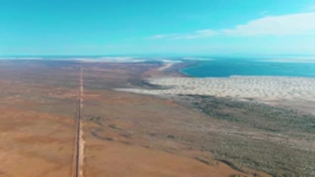 GUERRERO NEGRO BCS MEXICO-2022: Vehicle Traveling on Desert Road Toward Salt Lake