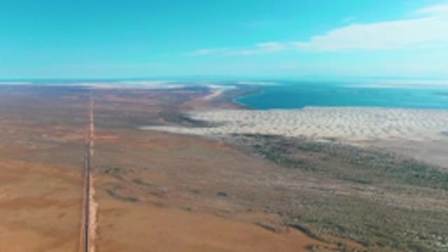 GUERRERO NEGRO BCS MEXICO-2022: Desert Road Leading to Saltwater Shore