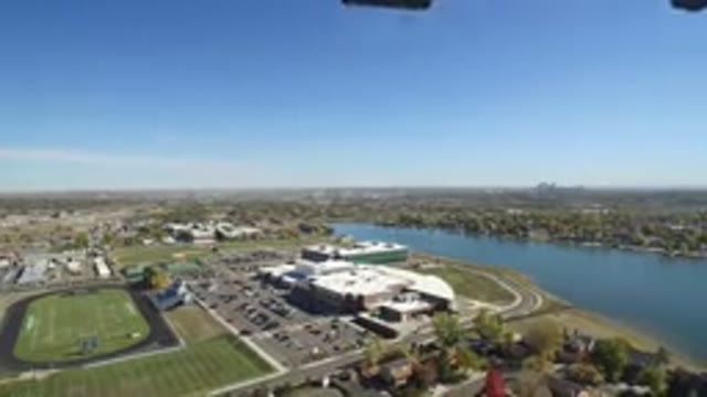 HIDDEN LAKE COLORADO-2016: Moving Drone Flying Over A Suburban Area With A River