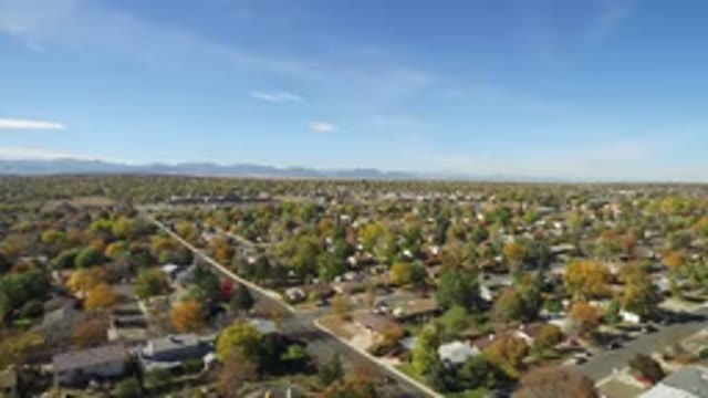 HIDDEN LAKE COLORADO-2016: Aerial Photo Of A Small Suburban Town While Light