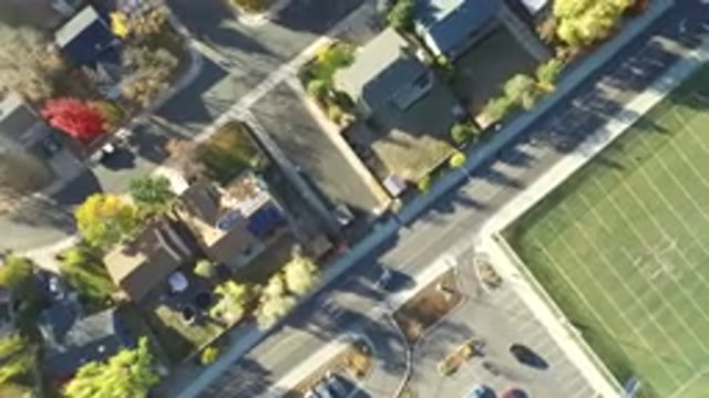 HIDDEN LAKE COLORADO-2016: Bright And Sunny Day Cars Driving Houses Parking Lots