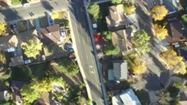 HIDDEN LAKE COLORADO-2016: Aerial View Of A Street With Tree Houses And Cars