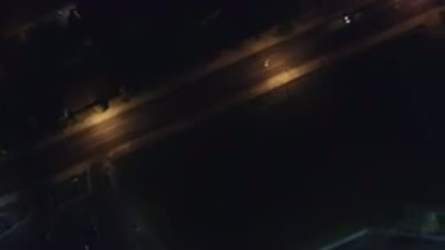 HIDDEN LAKE COLORADO-2016: An Aerial View Of A Dark Road With Street Lamps On
