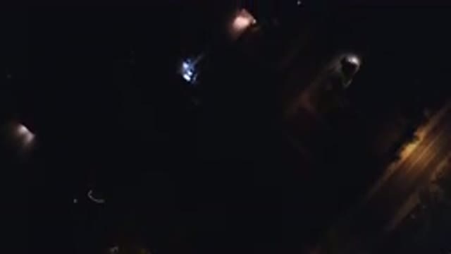 HIDDEN LAKE COLORADO-2016: Aerial View In The Night Of A Town With A Lit Road And