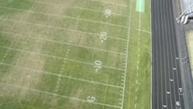 HIDDEN LAKE COLORADO-2016: Aerial View Of A Green Football Field And Track Field