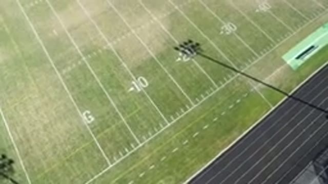HIDDEN LAKE COLORADO-2016: Aerial View Of An Empty Green Football Field On A