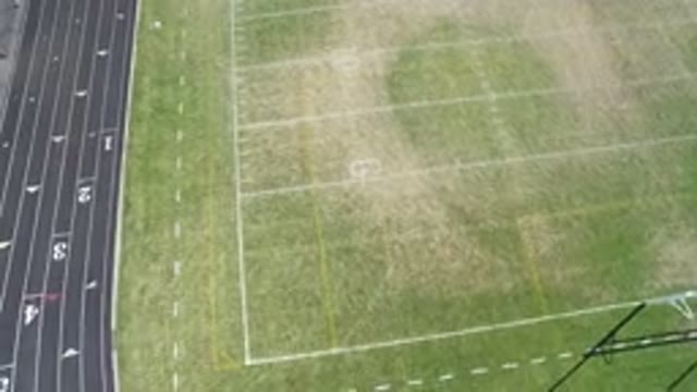HIDDEN LAKE COLORADO-2016: An Aerial View Of A Green Football Field And There Is