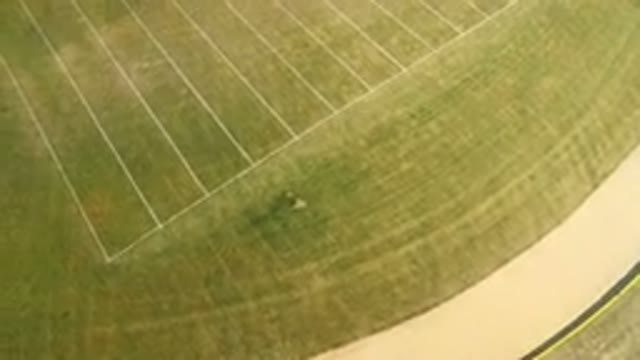 HIDDEN LAKE COLORADO-2016: An Aerial View Of A Grassy Green Field And A Road