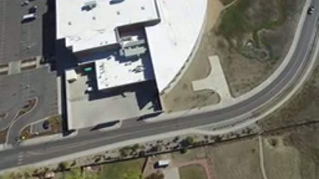 HIDDEN LAKE COLORADO-2016: Car Driving Through A Road Passing Next To A Big And