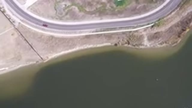 HIDDEN LAKE COLORADO-2016: Top View Of A Road Beside A River On A Sunny Day