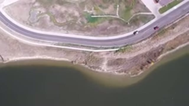 HIDDEN LAKE COLORADO-2016: An Aerial View Of A Highway Going Along The Coast