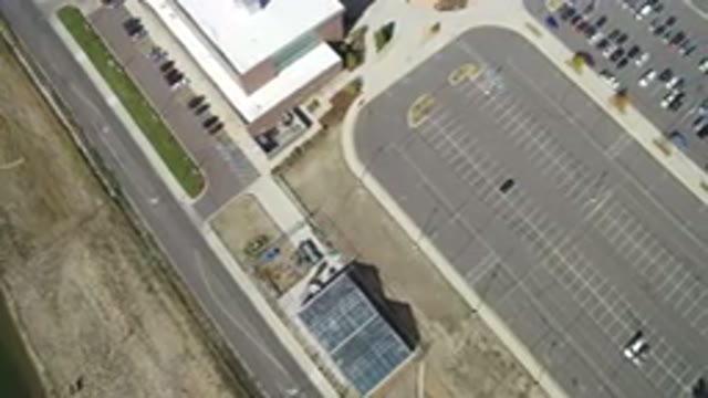HIDDEN LAKE COLORADO-2016: School Parking Lot With Cars Near Empty Buildings