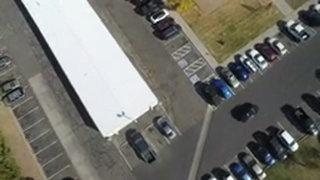 HIDDEN LAKE COLORADO-2016: Black Car In A Parking Lot Looking For A Place To