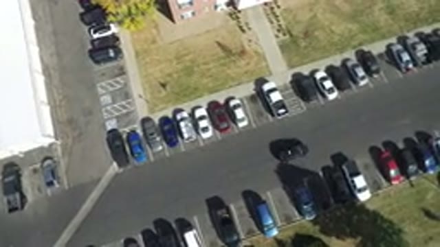 HIDDEN LAKE COLORADO-2016: Top Camera View Of A Black Car Driving Along The