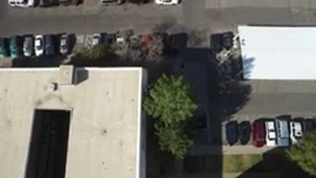 HIDDEN LAKE COLORADO-2016: Overhead View Of A Factory With Its Cars On A Sunny Day
