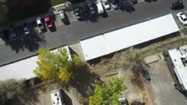 HIDDEN LAKE COLORADO-2016: Aerial Video Of A Giant Building With A Parking Light