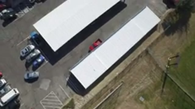 HIDDEN LAKE COLORADO-2016: Car Driving Out Of A Covered Parking Lot