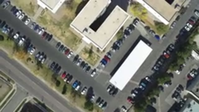 HIDDEN LAKE COLORADO-2016: Space Satellite View Of Two Buildings In A Parking Lot