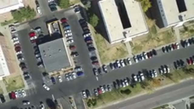 HIDDEN LAKE COLORADO-2016: Lot Of Cars In Parking Lot Big Buildings Trees Maze