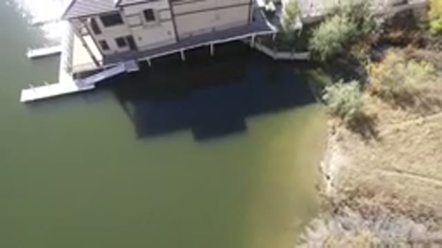 HIDDEN LAKE COLORADO-2016: The Top View Of A Beautiful White Lake House Beside A