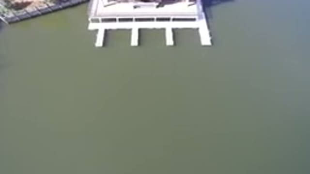 HIDDEN LAKE COLORADO-2016: Birds Eye View Of A White Pier On A Calm Body Of Water