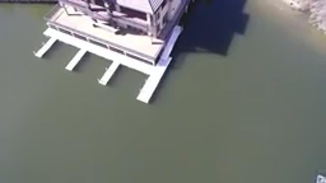HIDDEN LAKE COLORADO-2016: Aerial View Of A House Next To A Sea And A Road