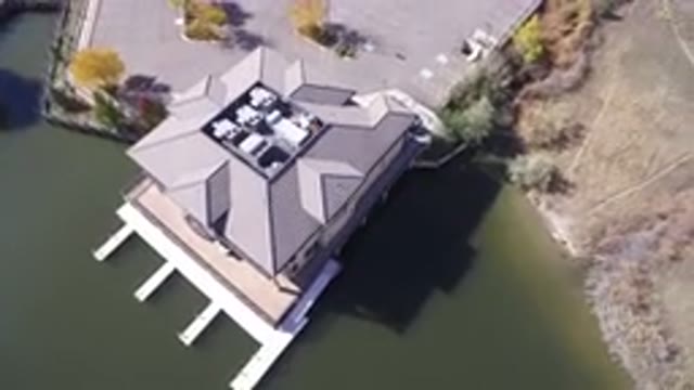 HIDDEN LAKE COLORADO-2016: Top View Of A Large House With A Lake Beside It
