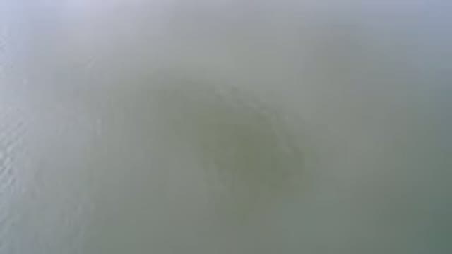 HIDDEN LAKE COLORADO-2016: Above View Of Quiet Water Line During Day Time When