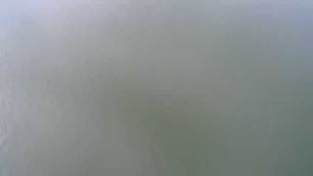 HIDDEN LAKE COLORADO-2016: Birds Eye View Of Grey Murky Water On A Sunny Day