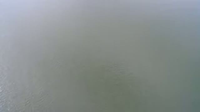 HIDDEN LAKE COLORADO-2016: High Aral Drone View Panning Over Sunny Ocean Waves