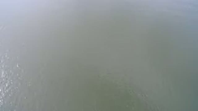 HIDDEN LAKE COLORADO-2016: Camera View From A Drone Showing The Top Of A Green Lake