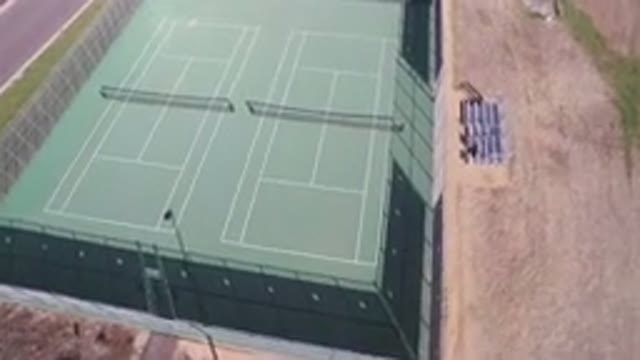 HIDDEN LAKE COLORADO-2016: Drone Top View of Tennis Court, Sand, Rocks, and Flying Bird