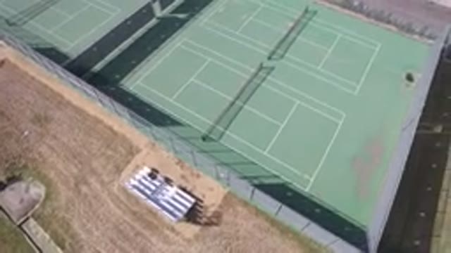 HIDDEN LAKE COLORADO-2016: Aerial View Of Green And Empty Tennis Squares