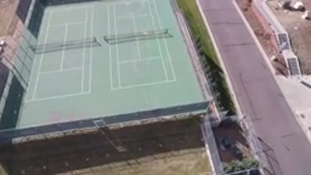 HIDDEN LAKE COLORADO-2016: Aerial View Panning Across An Empty Double Tennis Court