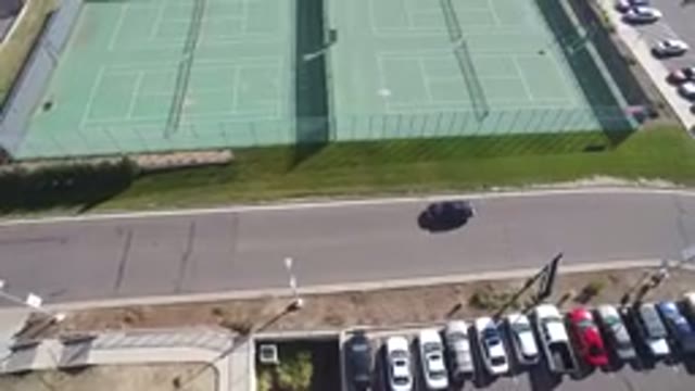 HIDDEN LAKE COLORADO-2016: Four Tennis Stadiums Surrounded By A Fence With