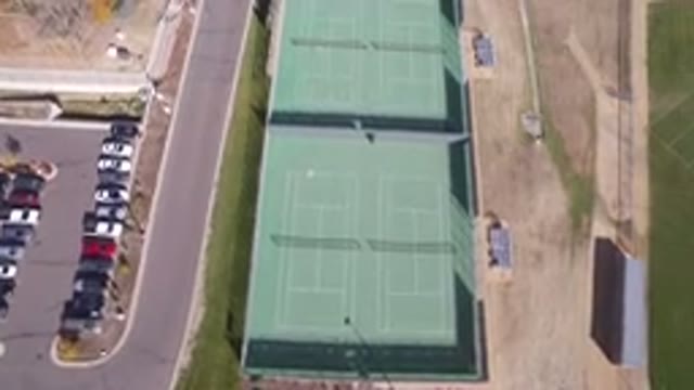 HIDDEN LAKE COLORADO-2016: Aerial View Of A Parking Lot And Tennis Courts Nearby