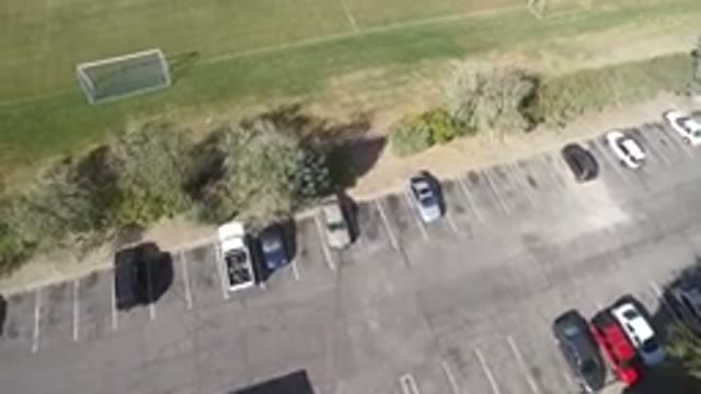 HIDDEN LAKE COLORADO-2016: An Aerial View Of A Parking Lot With A Few Cars And A Soccer Field