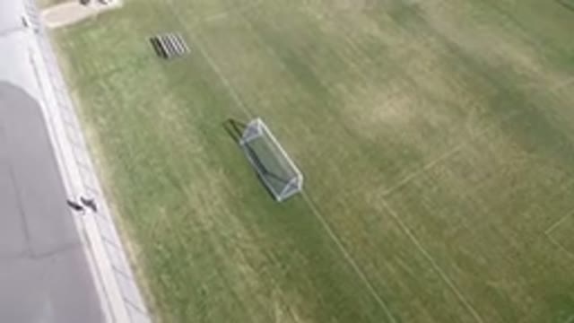 HIDDEN LAKE COLORADO-2016: A Soccer Field With People Walking Around It On A